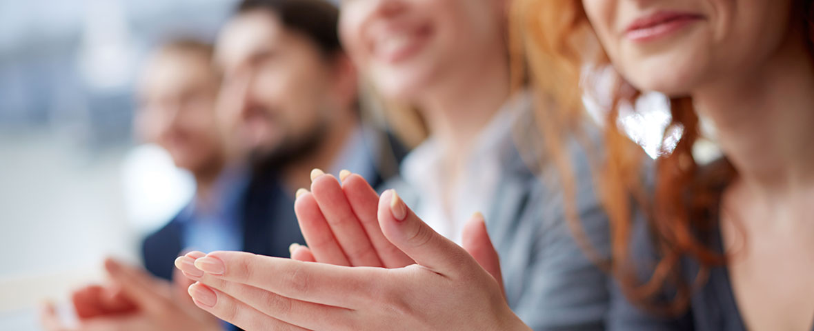 office workers hands clapping