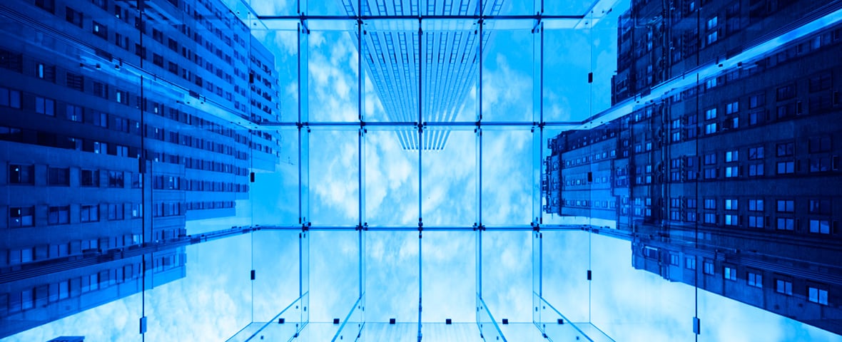 looking up at skyscrapers