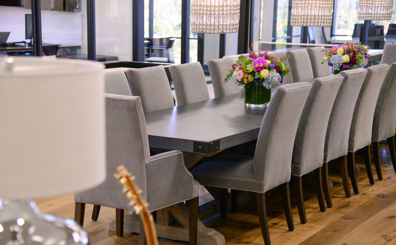 Each of our offices features a large farm table - perfect for our team to enjoy lunch together as a family!]