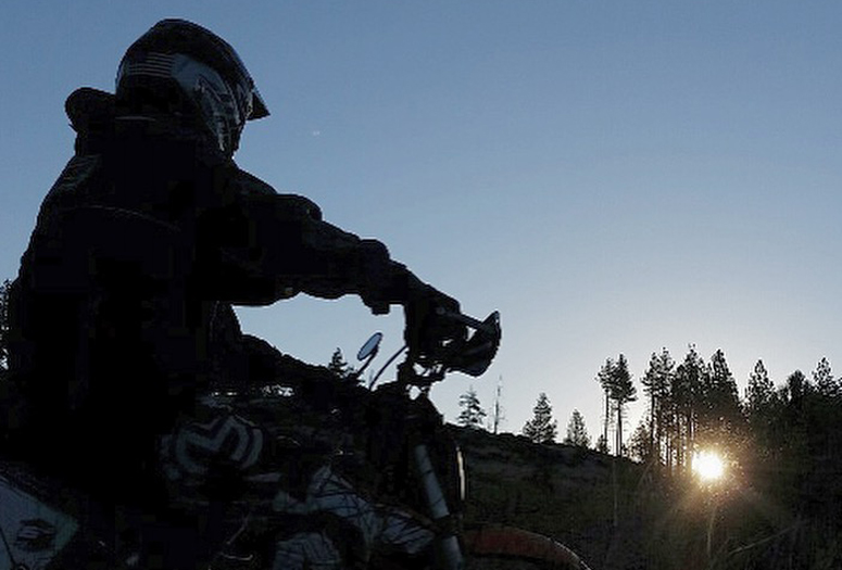 SVP Dave Bates watched the sun rise from his dirt bike while camping in the Sierras.