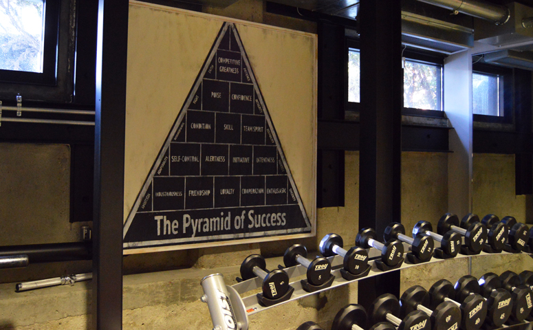 john-wooden-pyramid-of-success-in-hughes-marino-headquarters-gym